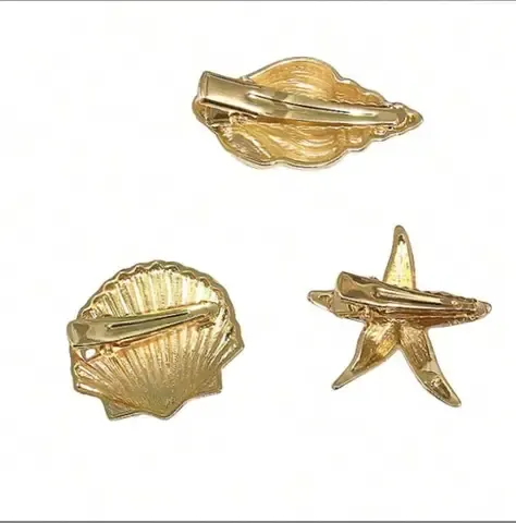 Goldene Seestern-Haarspange mit Entenschnabel